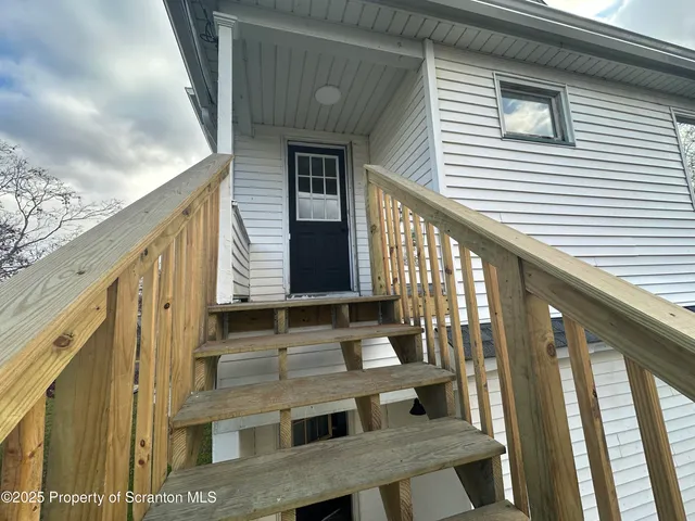 a view of balcony with furniture