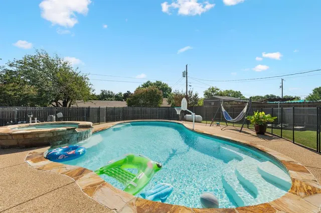 a view of a swimming pool with a lounge chairs