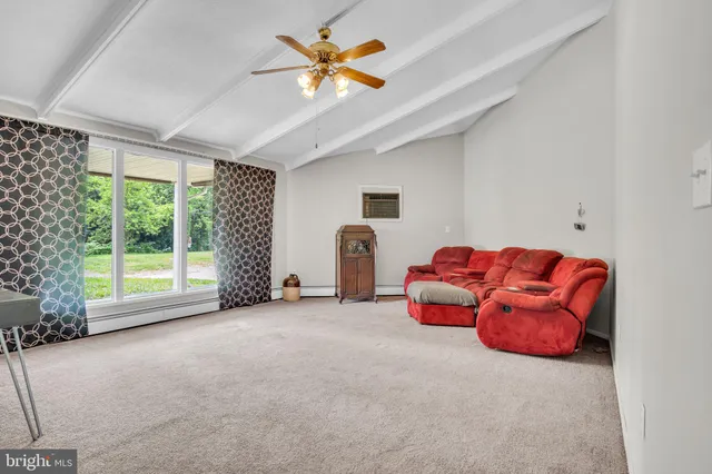 a room with furniture and a large window