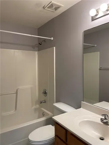 a bathroom with a sink toilet tub and shower