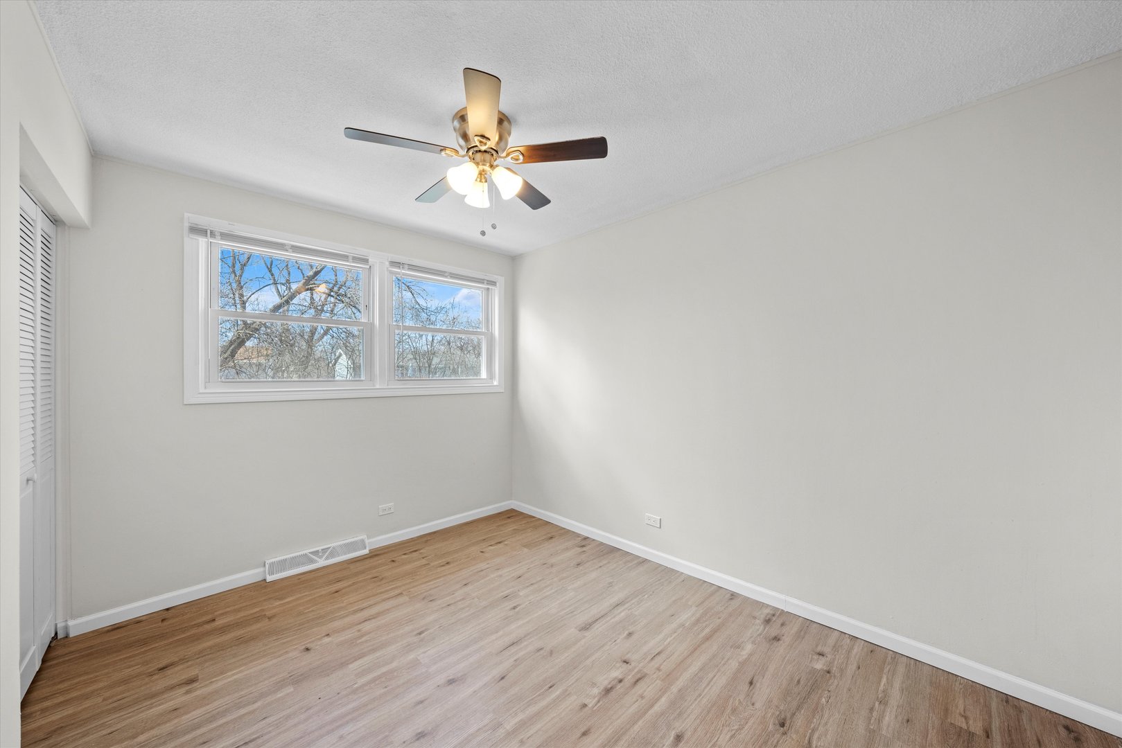 3508 Maple Lane Hazel Crest, IL 60429 - Photo 12 of 34 a view of a big room with wooden floor and windows