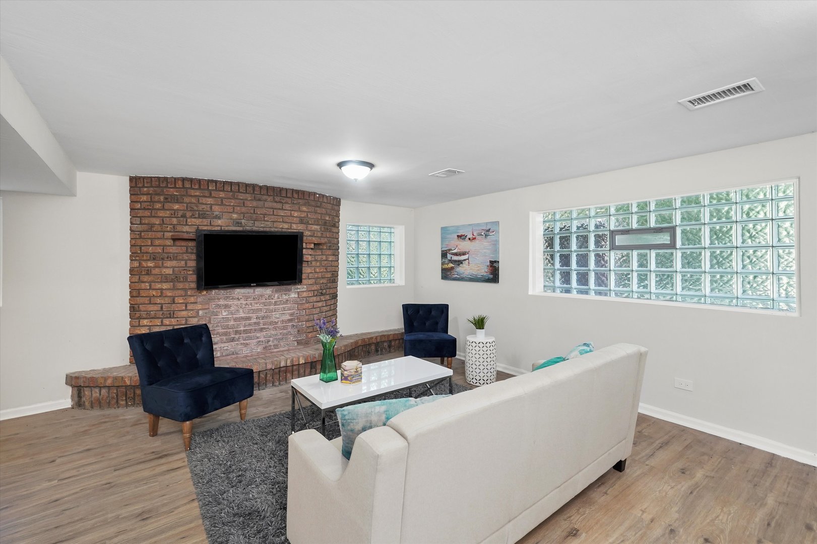 3508 Maple Lane Hazel Crest, IL 60429 - Photo 19 of 34 a living room with furniture and a flat screen tv