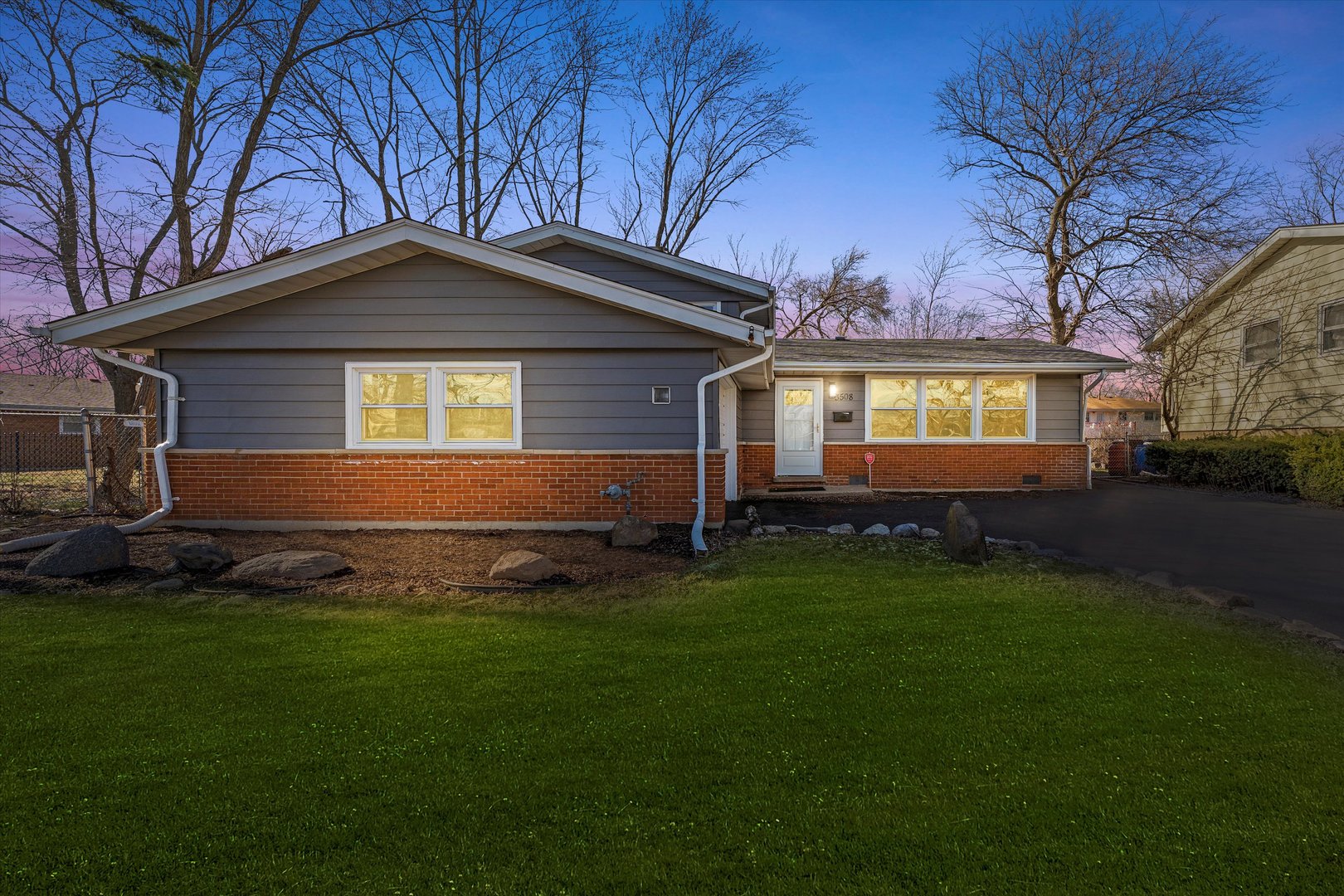 3508 Maple Lane Hazel Crest, IL 60429 - Photo 2 of 34 a front view of a house with a yard