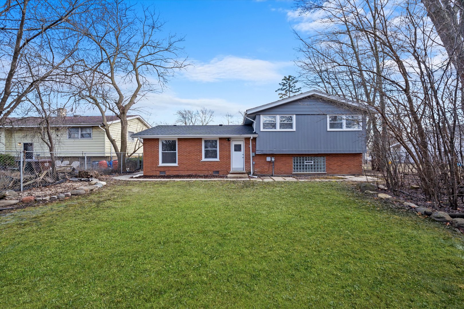 3508 Maple Lane Hazel Crest, IL 60429 - Photo 26 of 34 a view of a yard in front of a house with large trees