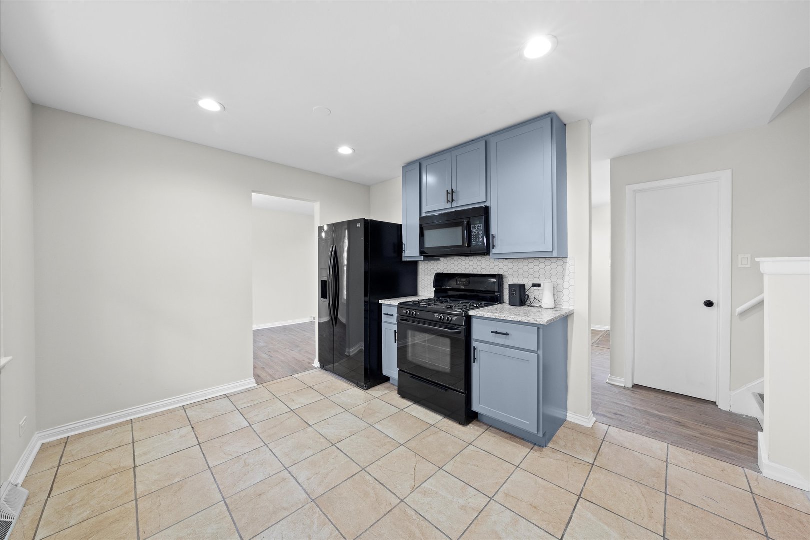3508 Maple Lane Hazel Crest, IL 60429 - Photo 10 of 34 a kitchen with a refrigerator a stove top oven and a sink