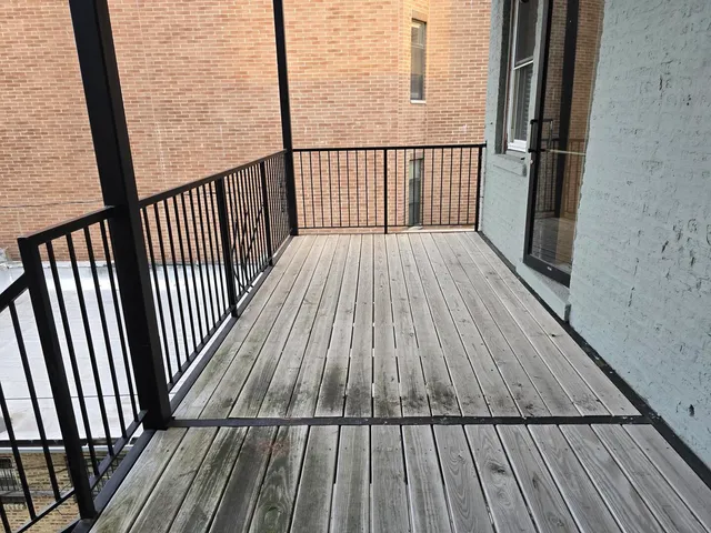 a balcony with wooden floor