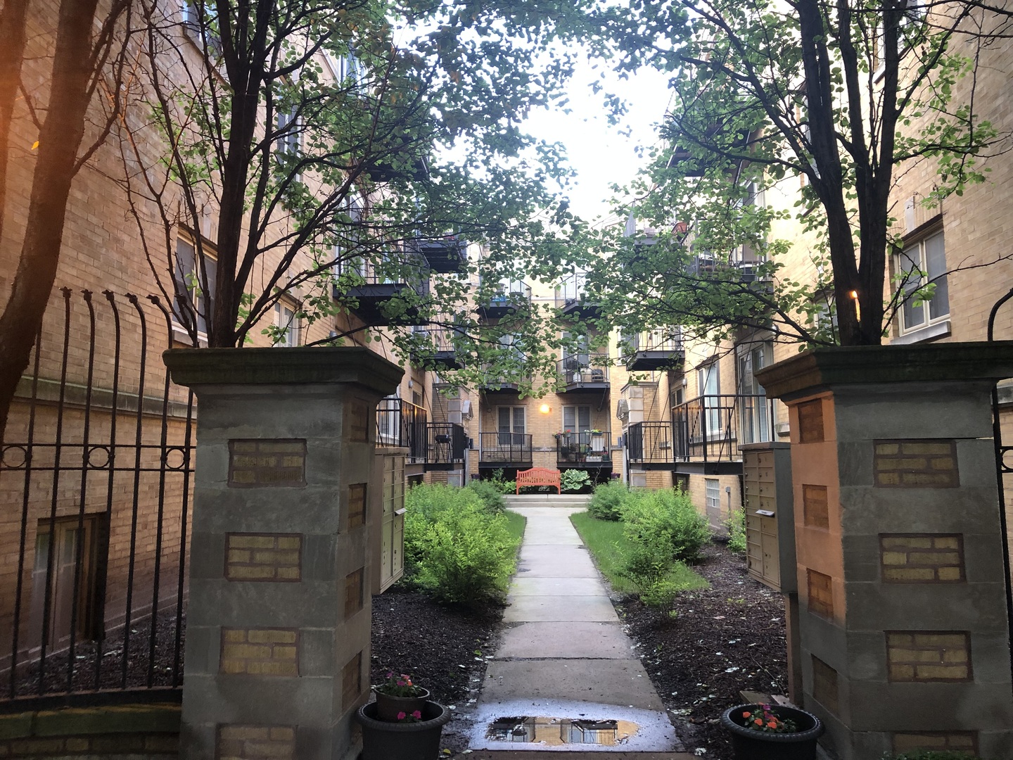 1468 East 69th Street, Unit 2 Chicago, IL 60637 - Photo 2 of 5 a view of a patio with chair and tables back yard of the house