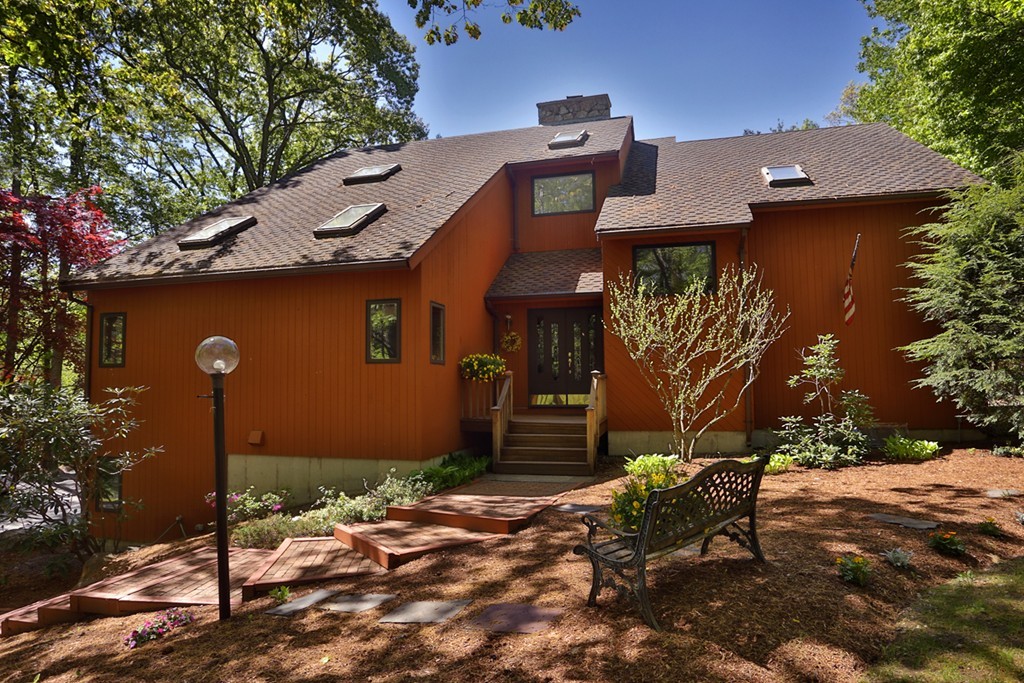 a front view of a house with garden