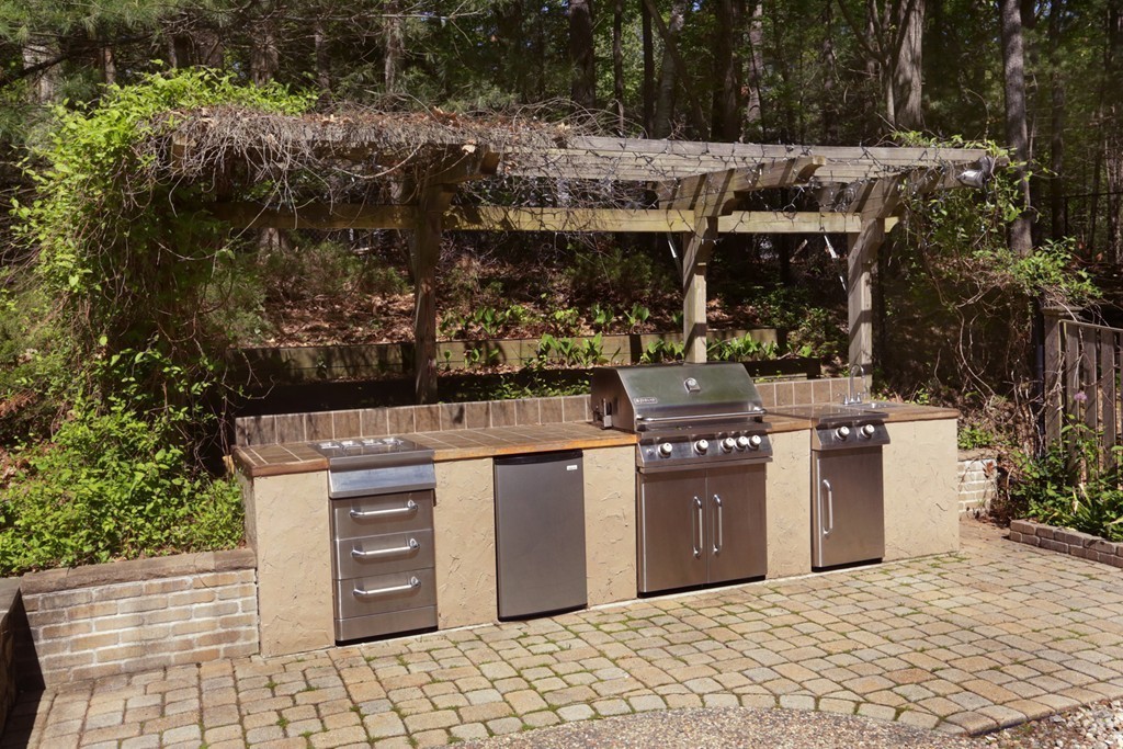 63 Porter Road Boxford, MA 01921 - Photo 20 of 30 a view of a chairs and table in backyard