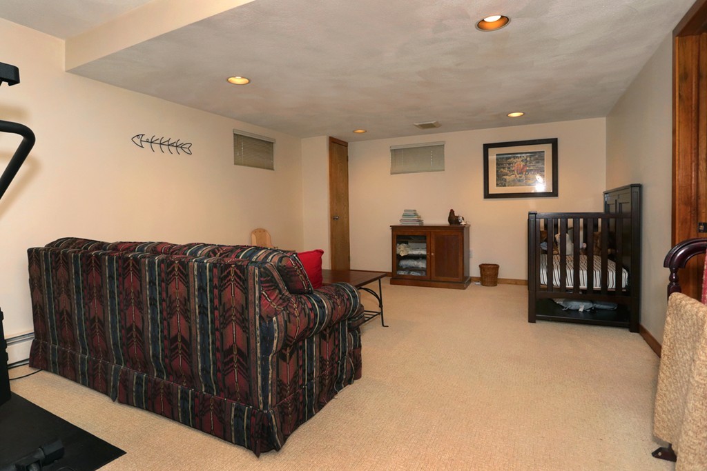 63 Porter Road Boxford, MA 01921 - Photo 28 of 30 a spacious bedroom with a bed and a couch