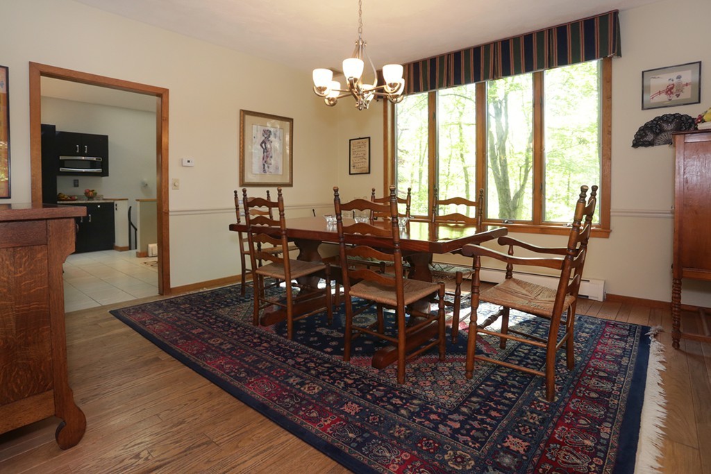 63 Porter Road Boxford, MA 01921 - Photo 6 of 30 a view of a dining room with furniture window and wooden floor