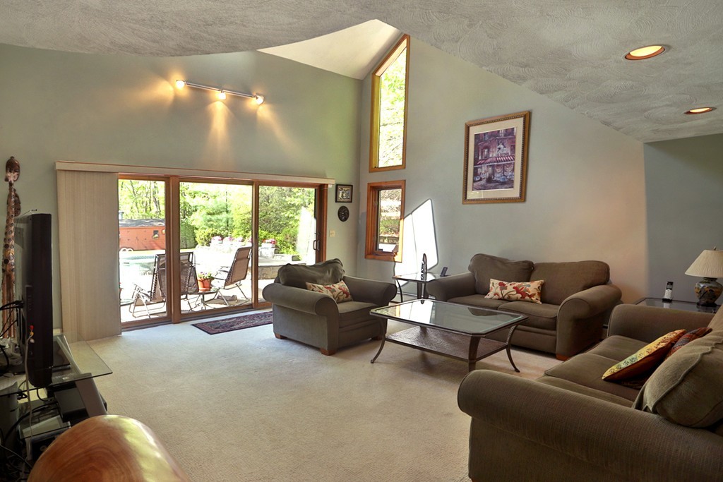 63 Porter Road Boxford, MA 01921 - Photo 10 of 30 a living room with furniture and a flat screen tv