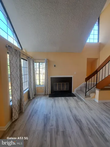 a bedroom with a bed and a night stand