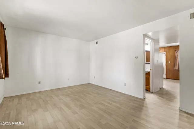 a kitchen with granite countertop cabinets stainless steel appliances and a sink