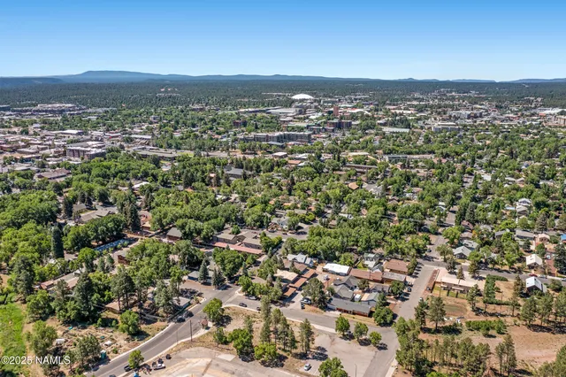 an aerial view of residential building and ocean