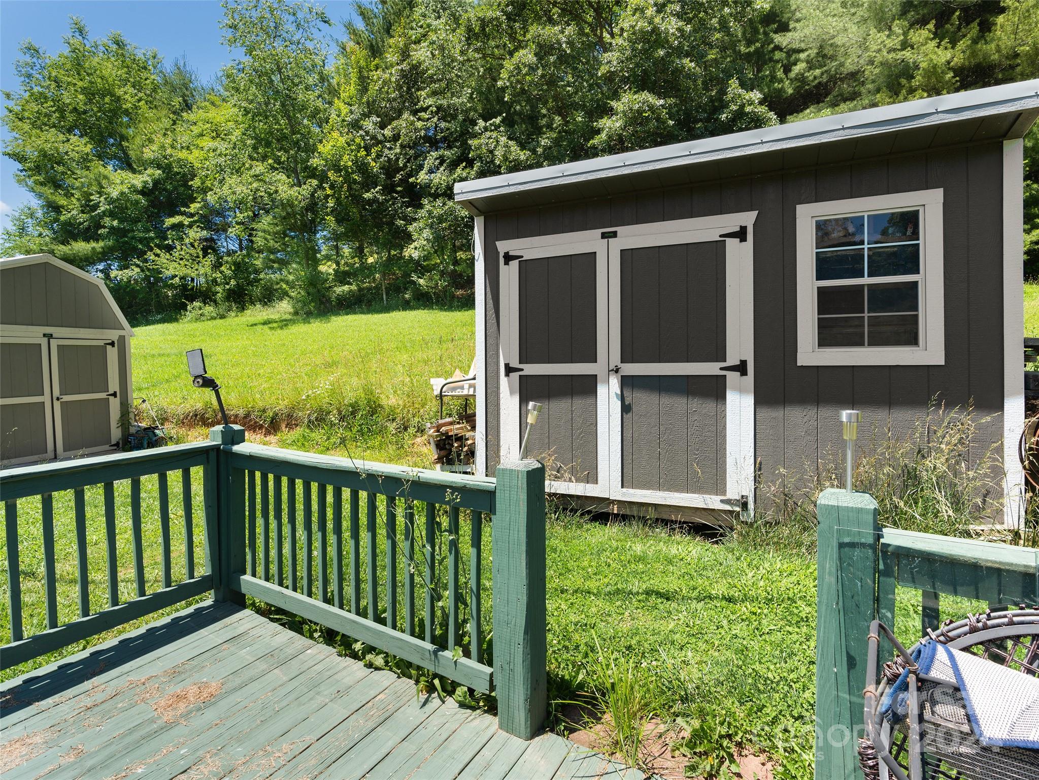 165 Van Arrington Road Clyde, NC 28721 - Photo 16 of 17 a porch with a yard