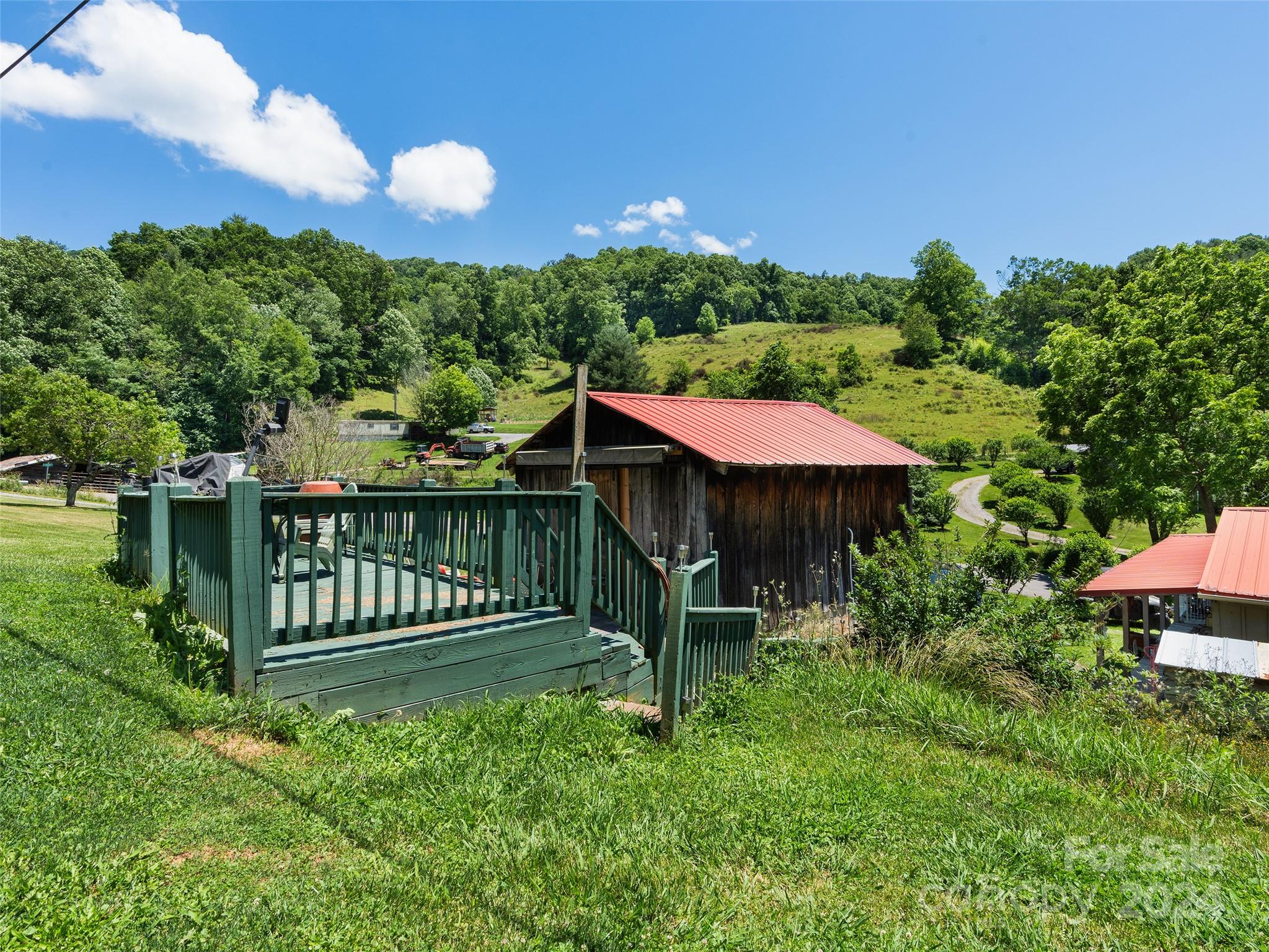 165 Van Arrington Road Clyde, NC 28721 - Photo 3 of 17 a view of a chair and table in the garden
