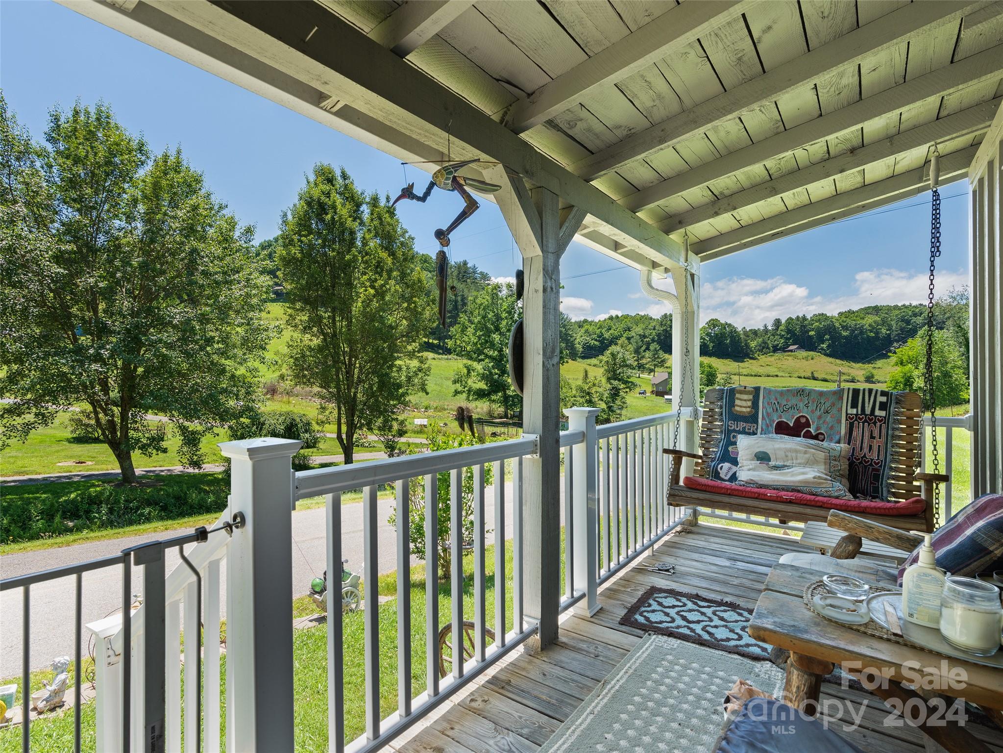 165 Van Arrington Road Clyde, NC 28721 - Photo 4 of 17 a view of a porch with wooden floor