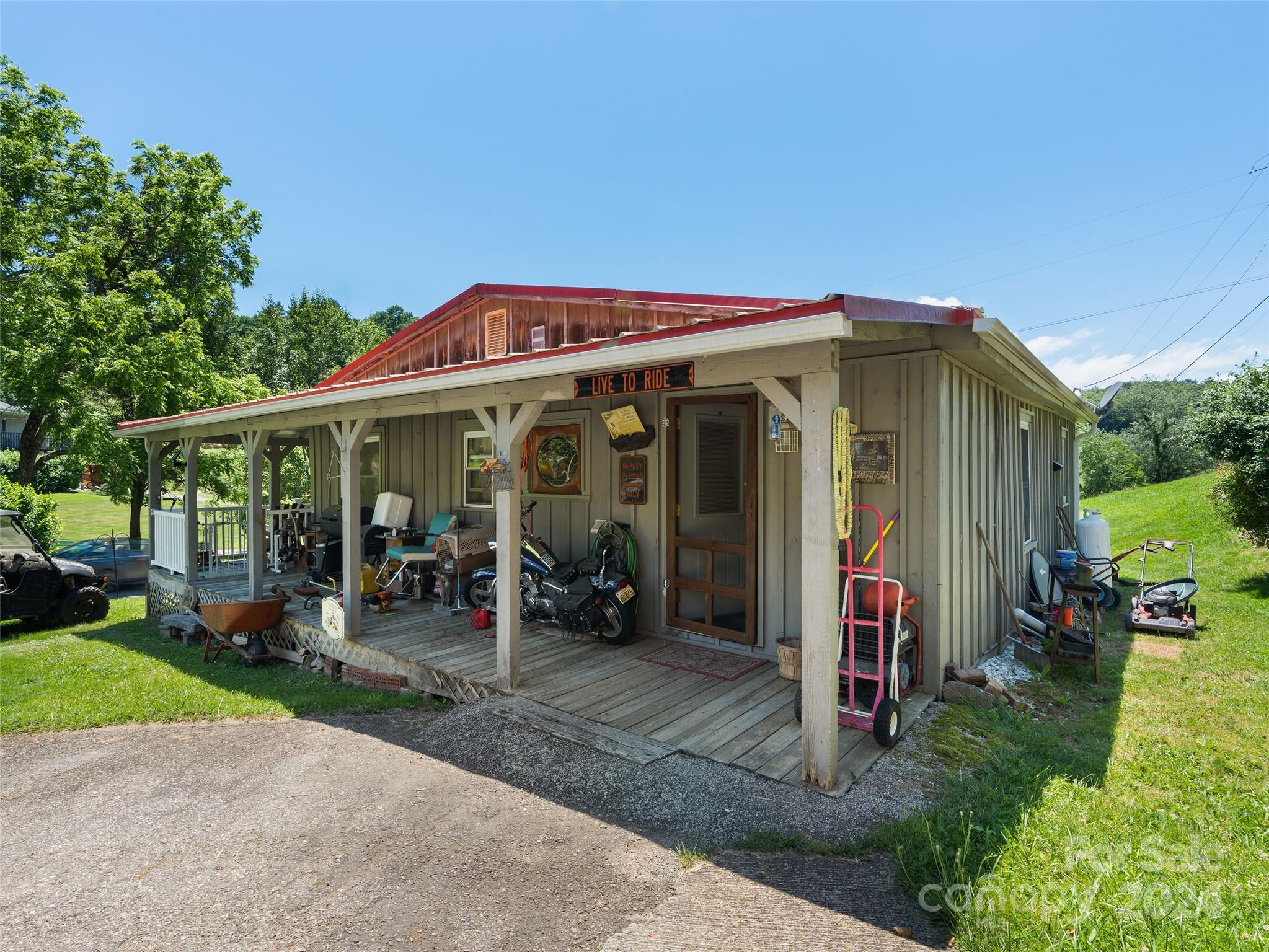 165 Van Arrington Road Clyde, NC 28721 - Photo 5 of 17 a view of a house with outdoor seating area