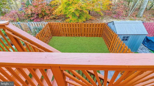 a wooden bench sitting in front of a building