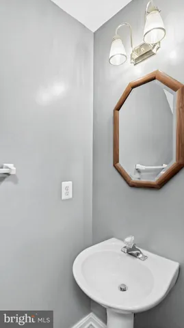a bathroom with a sink and mirror