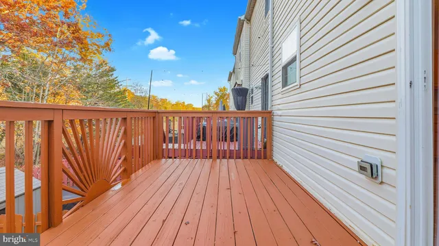 a balcony with wooden floor