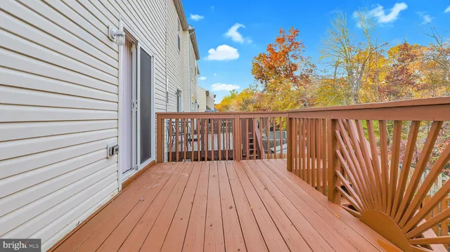 a balcony with wooden floor