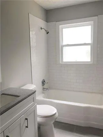a bathroom with a sink a toilet and a bathtub