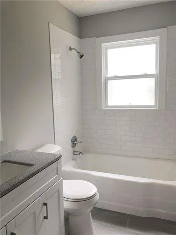 a bathroom with a sink a toilet and a bathtub