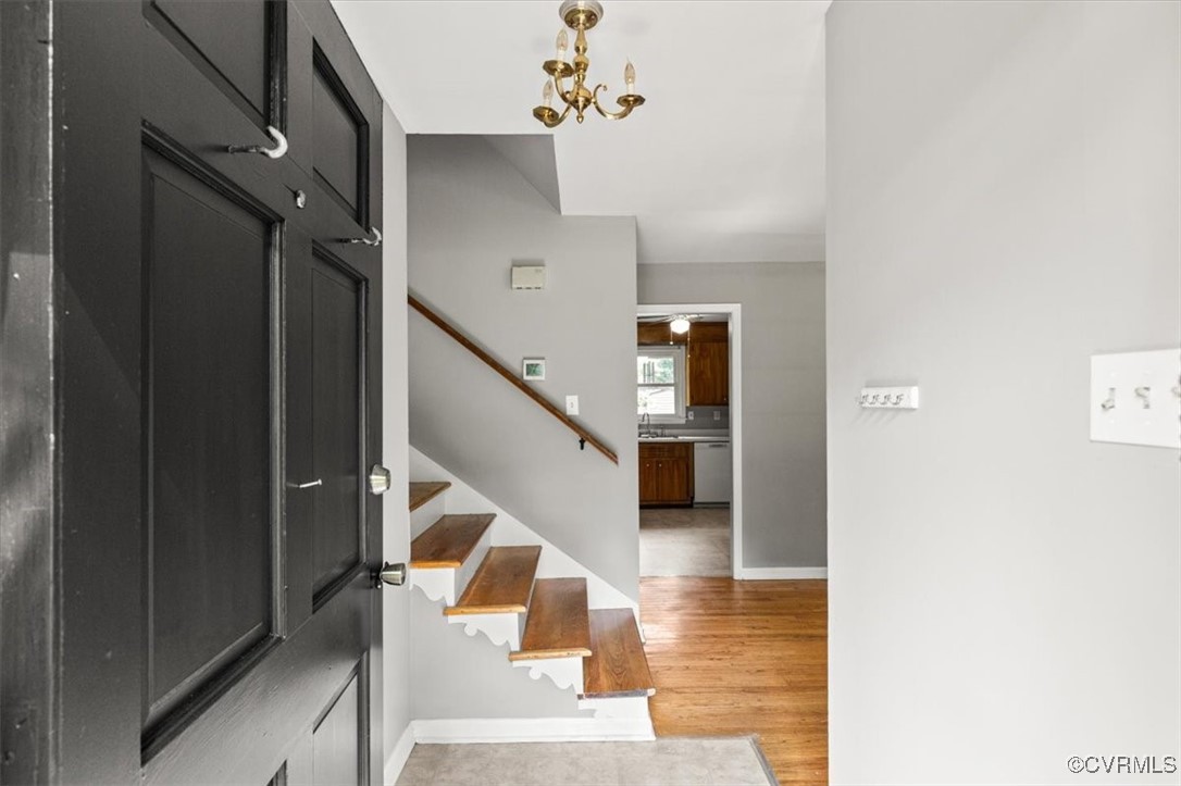 Foyer with stairway, light wood-type flooring, and