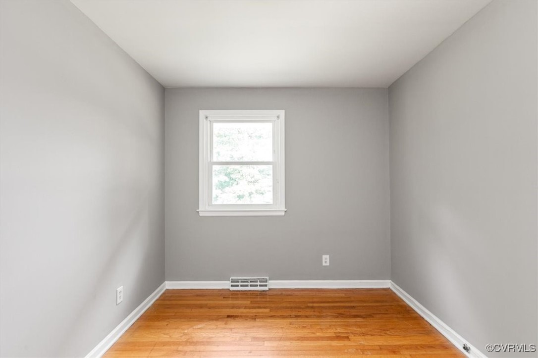 7801 Bull Hill Road Prince George, VA 23875 - Photo 31 of 49 Spare room with light wood finished floors and bas