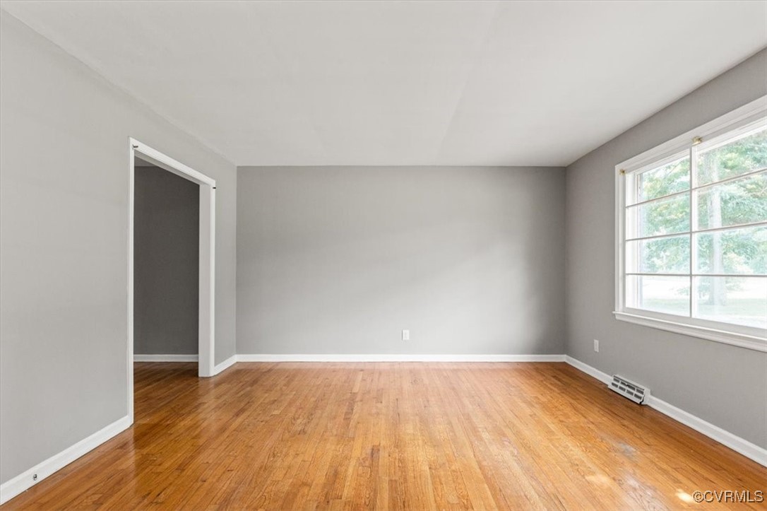Spare room with light wood-style flooring