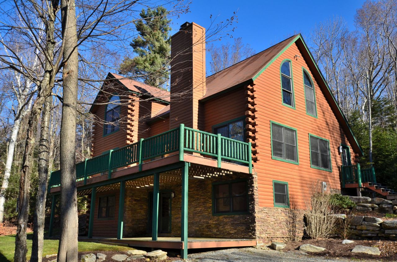697 Woodmere Road Becket, MA 01223 - Photo 1 of 23 a view of a house with a street