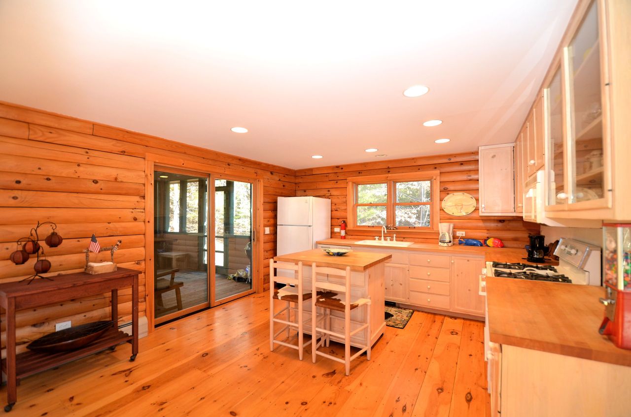 697 Woodmere Road Becket, MA 01223 - Photo 11 of 23 a room with lots of table and chairs