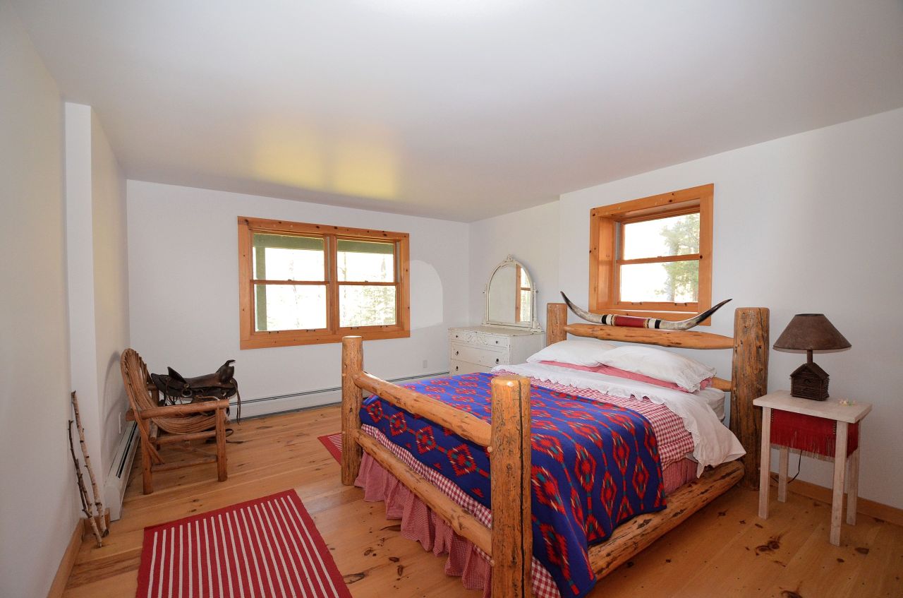 697 Woodmere Road Becket, MA 01223 - Photo 19 of 23 a bedroom with a bed and a window
