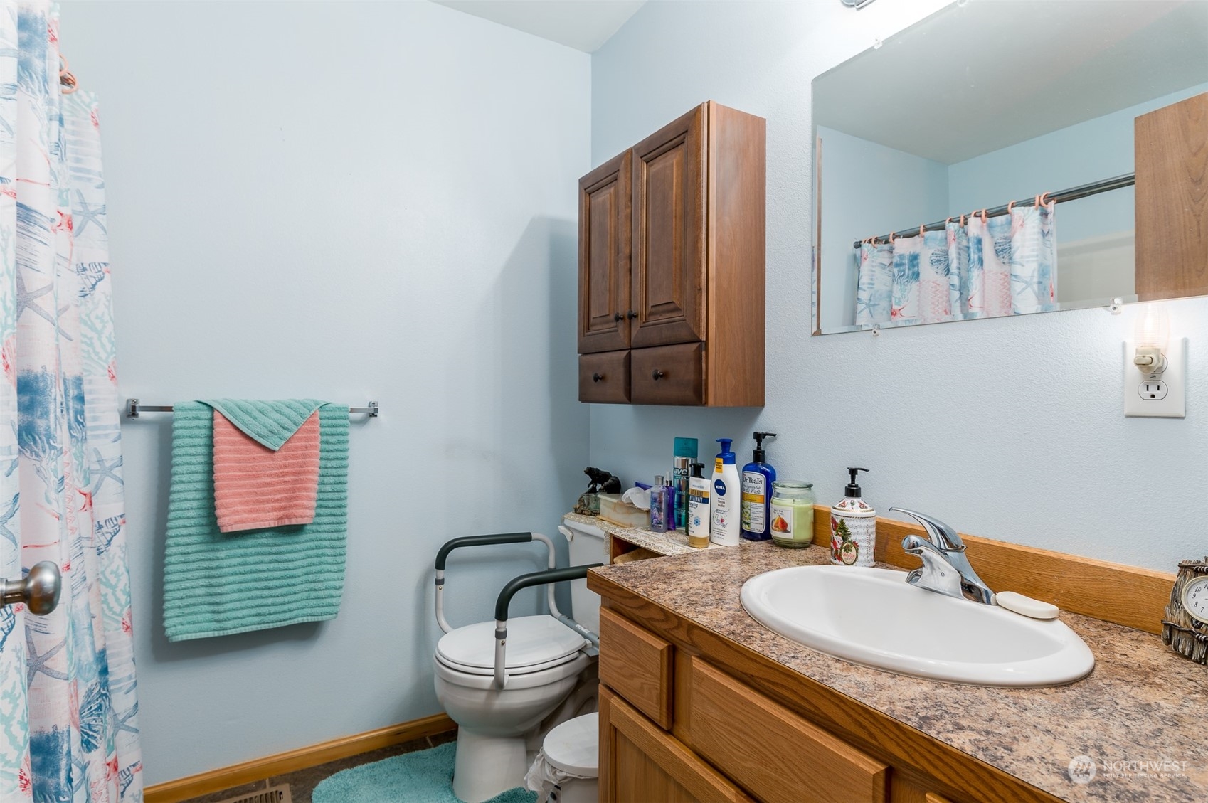 7863 Santa Fe Trail Maple Falls, WA 98266 - Photo 19 of 30 a bathroom with a granite countertop sink and a mirror