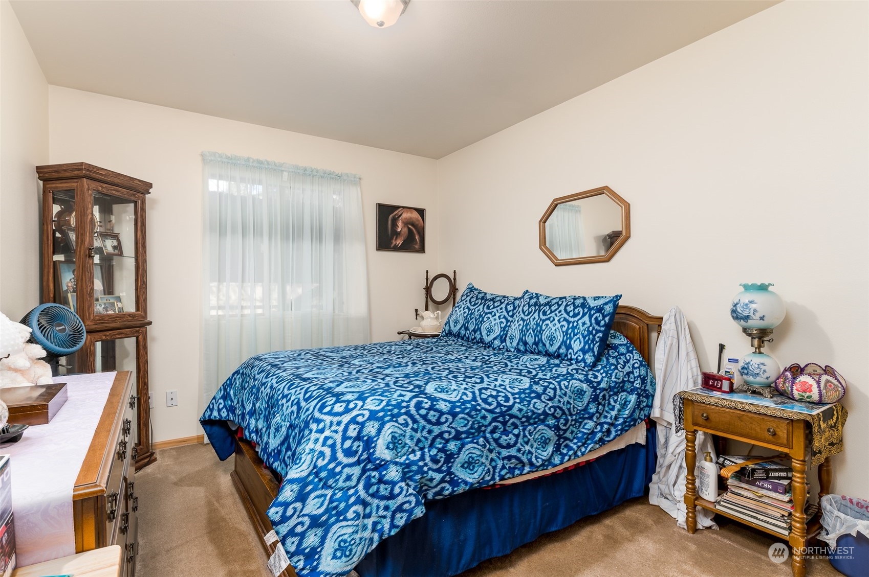 7863 Santa Fe Trail Maple Falls, WA 98266 - Photo 20 of 30 a bedroom with a bed and wooden floor