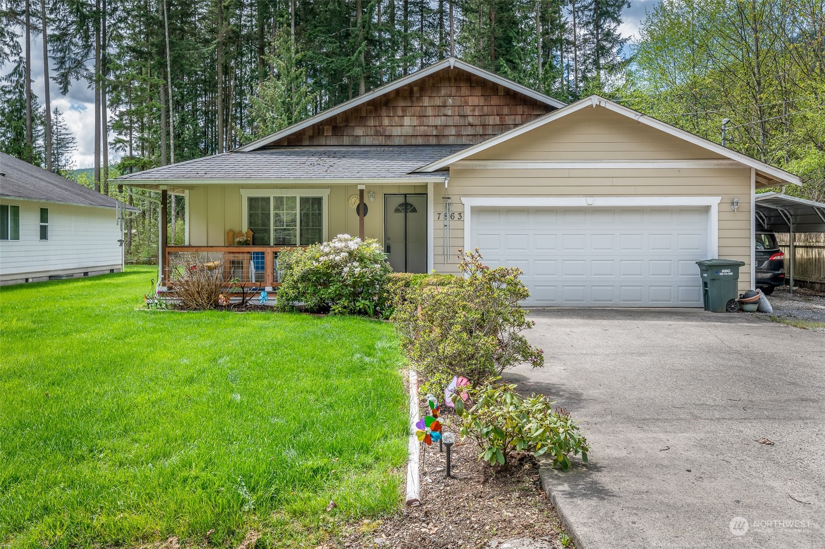 7863 Santa Fe Trail Maple Falls, WA 98266 - Photo 2 of 30 a front view of a house with garden