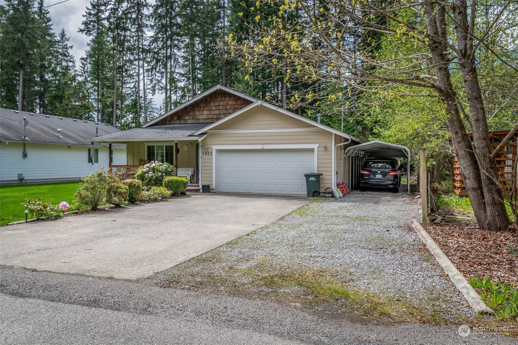 7863 Santa Fe Trail Maple Falls, WA 98266 - Photo 29 of 30 a front view of a house with a yard and garage