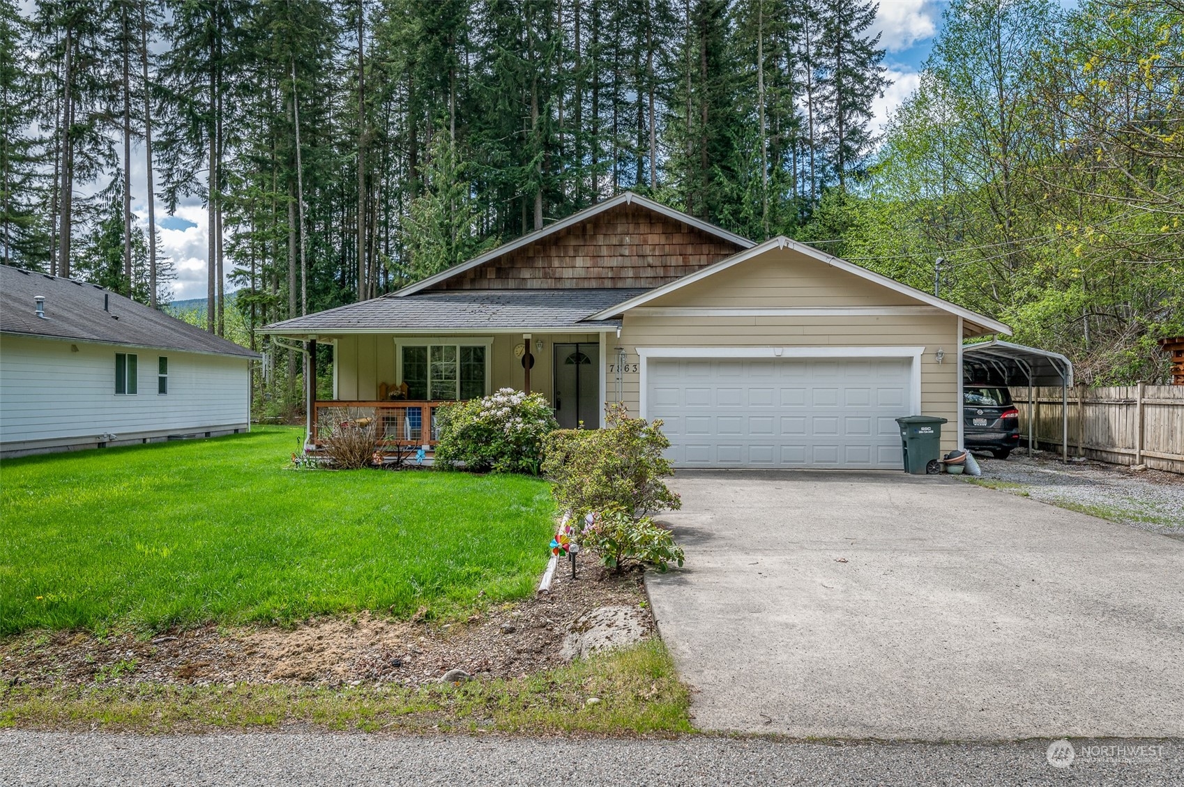 7863 Santa Fe Trail Maple Falls, WA 98266 - Photo 30 of 30 a front view of a house with a yard and garage