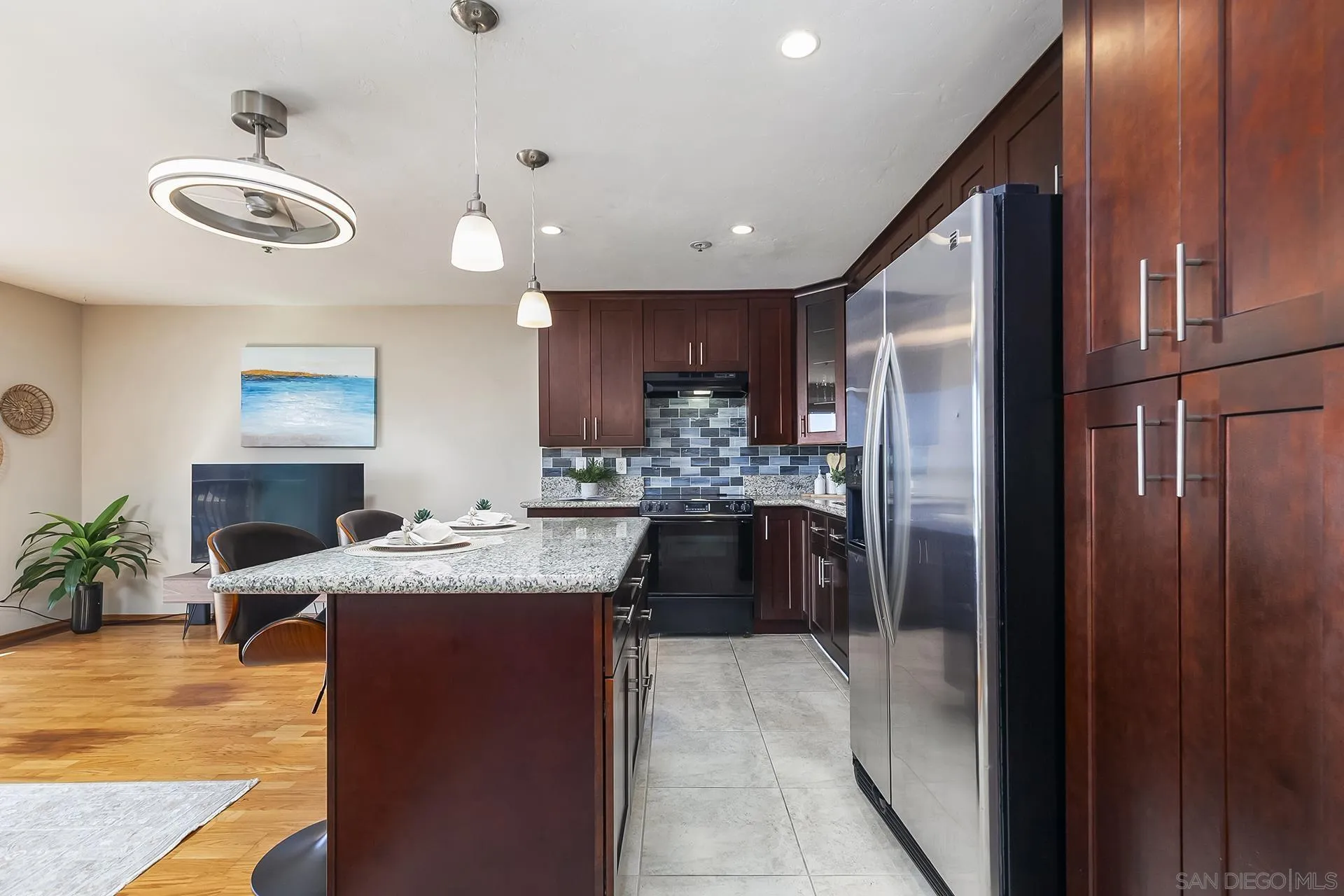 4878 Pescadero Avenue, Unit 103 San Diego, CA 92107 - Photo 15 of 72 a kitchen with cabinets and stainless steel appliances