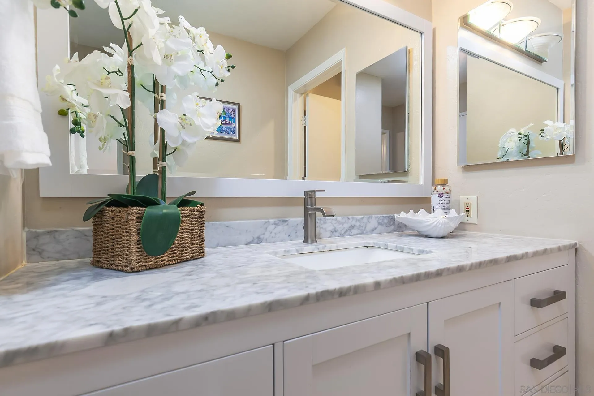 4878 Pescadero Avenue, Unit 103 San Diego, CA 92107 - Photo 34 of 72 a bathroom with sink granite and mirror