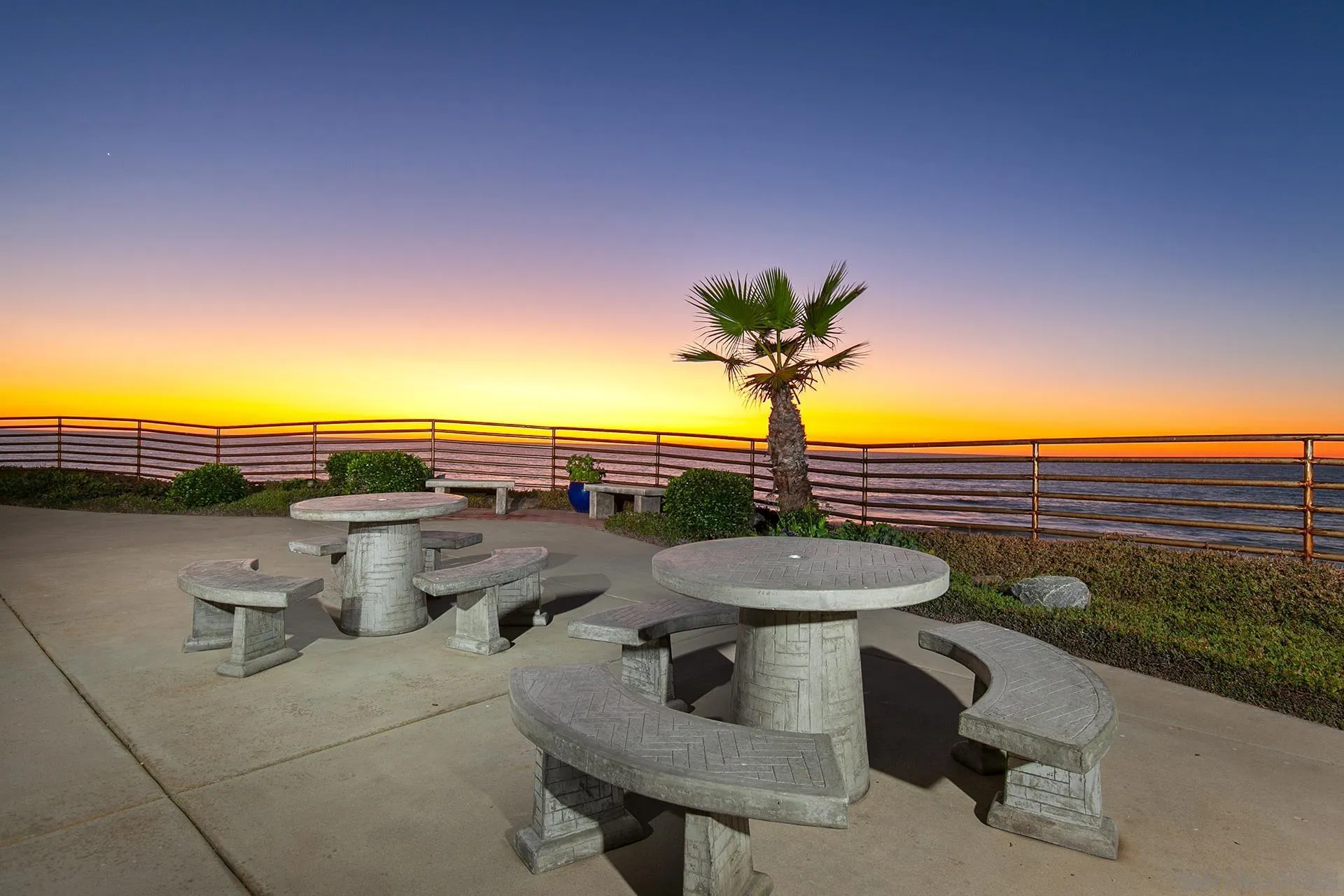 4878 Pescadero Avenue, Unit 103 San Diego, CA 92107 - Photo 61 of 72 a view of a terrace with a table and chairs