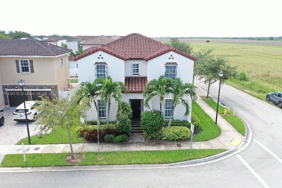 17182 Southwest 92nd Street Miami, FL 33196 - Photo 1 of 46 a aerial view of a house with a yard and potted plants