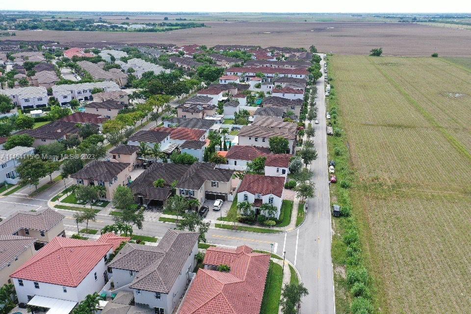 17182 Southwest 92nd Street Miami, FL 33196 - Photo 2 of 46 an aerial view of a city with lots of residential buildings
