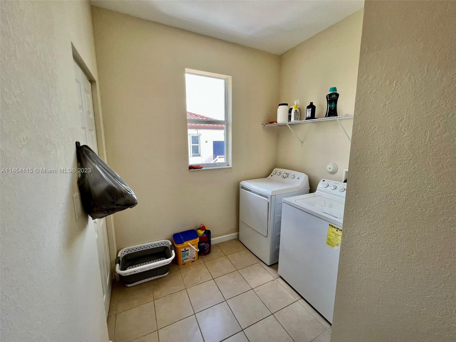 17182 Southwest 92nd Street Miami, FL 33196 - Photo 22 of 46 a room with a chair and appliances