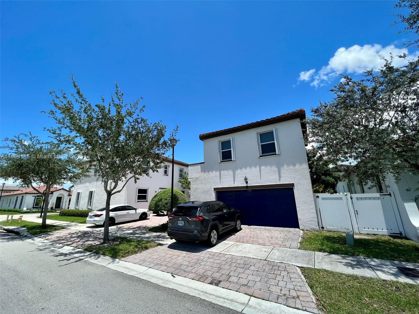 17182 Southwest 92nd Street Miami, FL 33196 - Photo 30 of 46 a view of a house with a patio