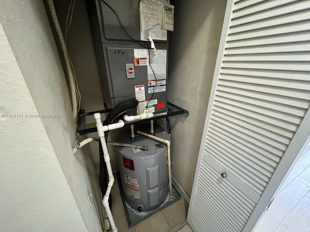 17182 Southwest 92nd Street Miami, FL 33196 - Photo 33 of 46 a utility room with dryer and washer