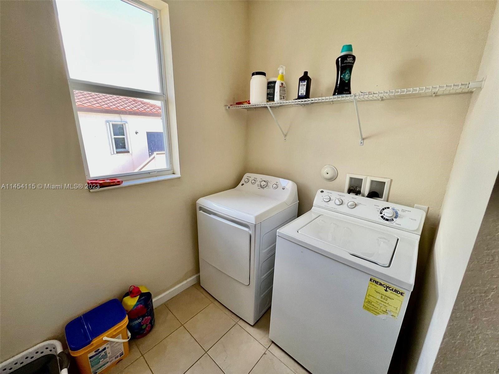 17182 Southwest 92nd Street Miami, FL 33196 - Photo 35 of 46 a utility room with dryer and washer