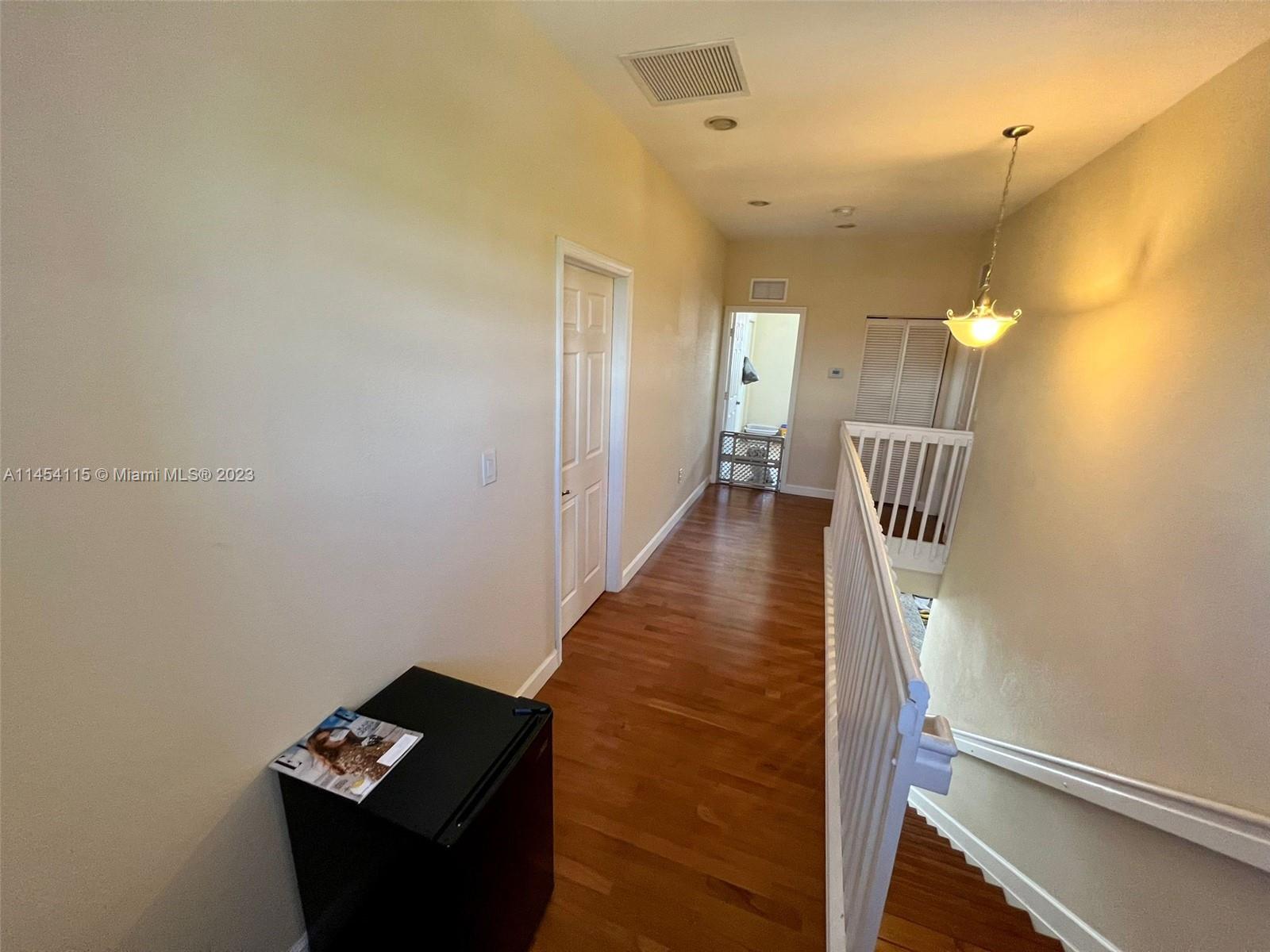 17182 Southwest 92nd Street Miami, FL 33196 - Photo 36 of 46 a view of hallway with stairs
